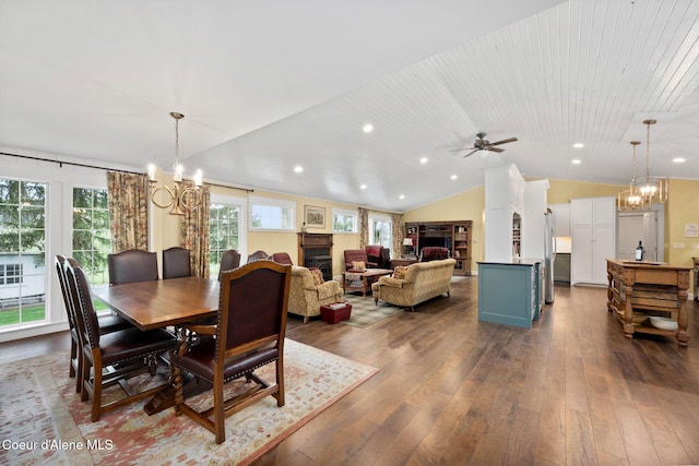 5570 E Dodd Rd, Hayden, ID 83835 - dining area featuring a chandelier, healthy amount of natural light, dark wood-type flooring, recessed lighting, and vaulted ceiling
