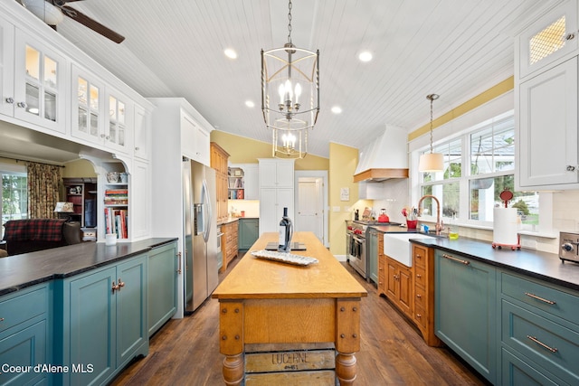 5570 E Dodd Rd, Hayden, ID 83835 - kitchen featuring custom exhaust hood, stainless steel appliances, wood ceiling, recessed lighting, and white cabinetry