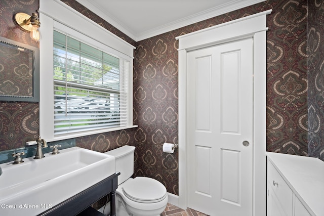 5570 E Dodd Rd, Hayden, ID 83835 - bathroom with wallpapered walls, vanity, and ornamental molding