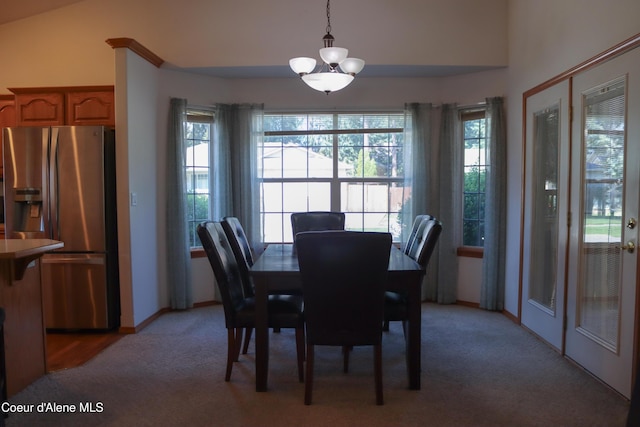 1276 W Edgewood Cir, Coeur Dalene, ID 83815 - dining space featuring light carpet, healthy amount of natural light, and a chandelier