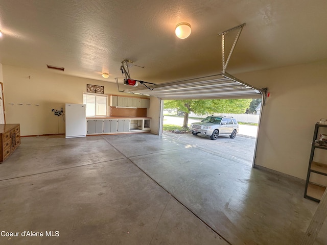 1276 W Edgewood Cir, Coeur Dalene, ID 83815 - garage featuring a garage door opener