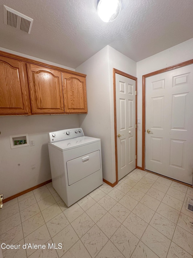 1276 W Edgewood Cir, Coeur Dalene, ID 83815 - laundry room with washer / dryer, cabinet space, and a textured ceiling