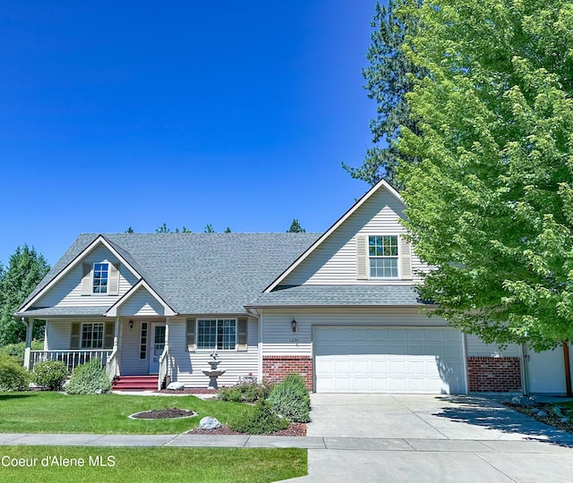 1276 W Edgewood Cir, Coeur Dalene, ID 83815 - traditional-style house with concrete driveway, brick siding, a garage, a front lawn, and roof with shingles