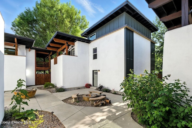 1106 Larch St Unit A, Sandpoint, ID 83864 - doorway to property with a patio, board and batten siding, and stucco siding