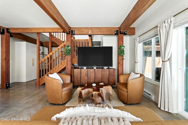 1106 Larch St Unit A, Sandpoint, ID 83864 - living area with beam ceiling, finished concrete flooring, a baseboard radiator, and stairway
