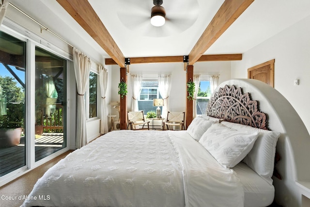 1106 Larch St Unit A, Sandpoint, ID 83864 - bedroom featuring beam ceiling, access to outside, and carpet