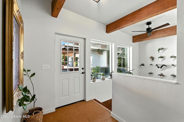 1106 Larch St Unit A, Sandpoint, ID 83864 - carpeted foyer with beamed ceiling and ceiling fan