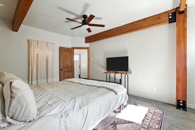 1106 Larch St Unit A, Sandpoint, ID 83864 - bedroom featuring beamed ceiling, concrete floors, and a ceiling fan