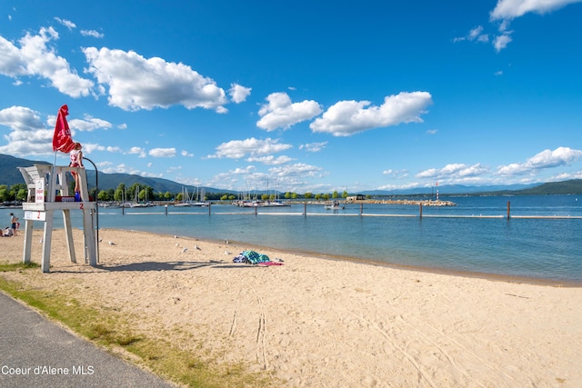 1106 Larch St Unit A, Sandpoint, ID 83864 - water view featuring nearby beach and a mountain backdrop