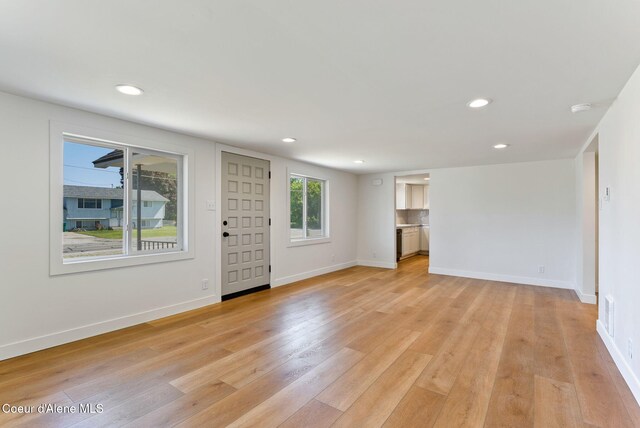 15116 E 4th Ave, Veradale, WA 99037 - unfurnished living room with light wood-style flooring and recessed lighting
