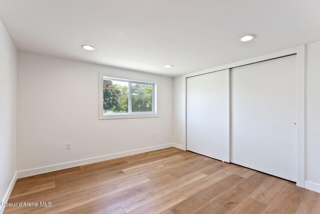 15116 E 4th Ave, Veradale, WA 99037 - unfurnished bedroom featuring light wood-style floors, a closet, and recessed lighting