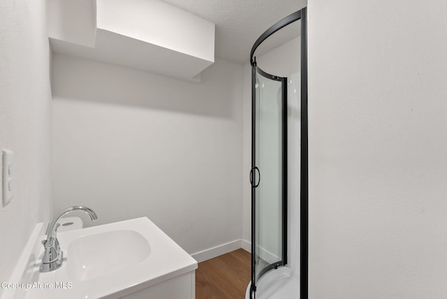 15116 E 4th Ave, Veradale, WA 99037 - full bathroom with a stall shower, wood finished floors, and vanity