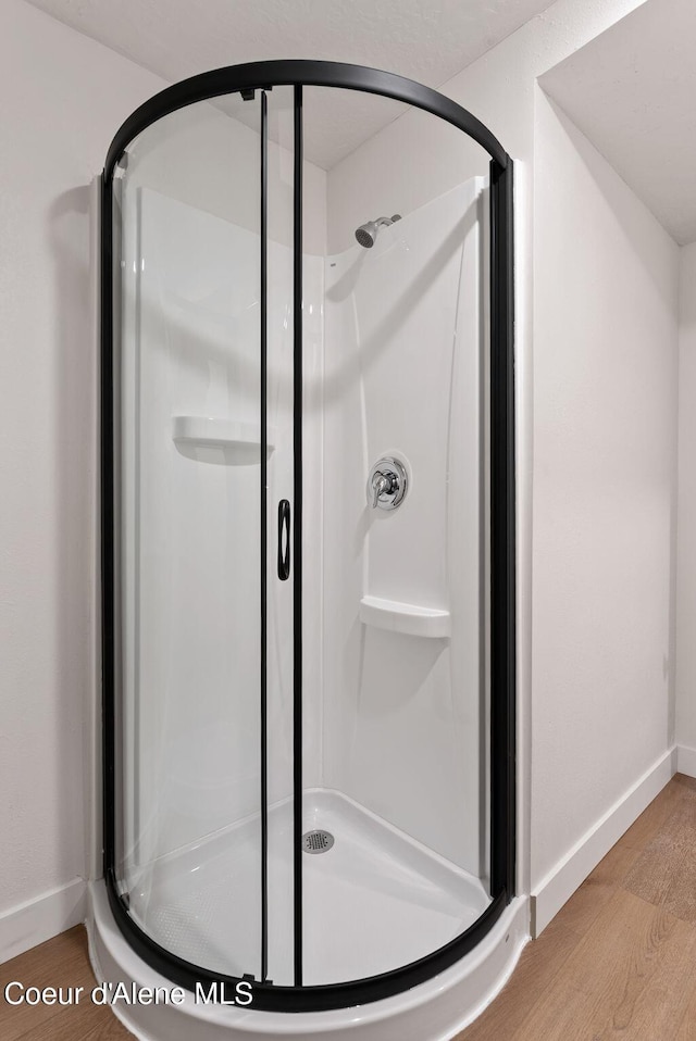15116 E 4th Ave, Veradale, WA 99037 - bathroom with a shower stall and wood finished floors