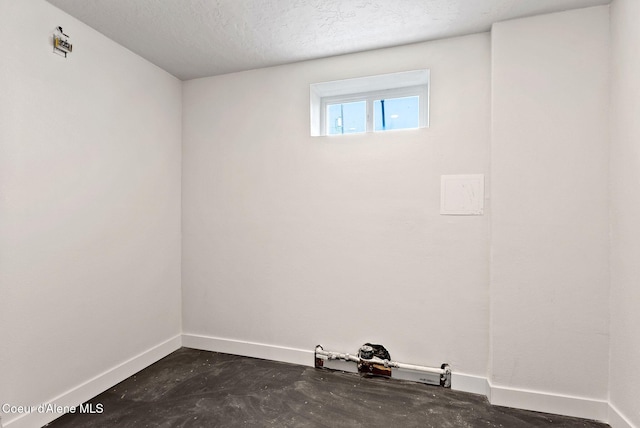 15116 E 4th Ave, Veradale, WA 99037 - spare room featuring baseboards and a textured ceiling