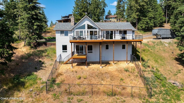 1273 S Grouse Meadow Dr, Coeur Dalene, ID 83814 - rear view of property with a deck, a chimney, and stairs