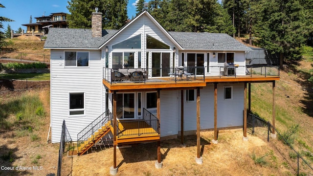 1273 S Grouse Meadow Dr, Coeur Dalene, ID 83814 - back of house with a chimney, a wooden deck, and a shingled roof