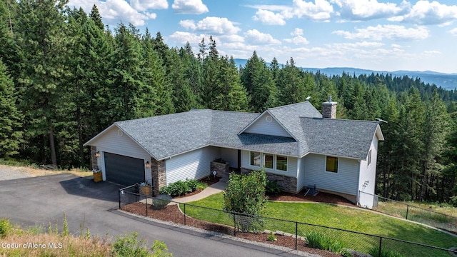 1273 S Grouse Meadow Dr, Coeur Dalene, ID 83814 - single story home with a forest view, a chimney, stone siding, and roof with shingles