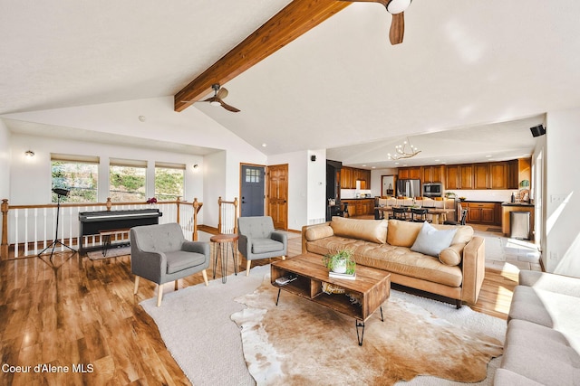 1273 S Grouse Meadow Dr, Coeur Dalene, ID 83814 - living room featuring light wood-style flooring, a chandelier, and ceiling fan