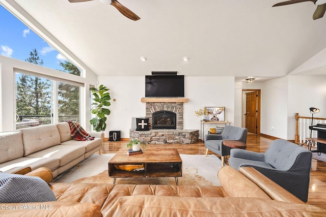 1273 S Grouse Meadow Dr, Coeur Dalene, ID 83814 - living area with a ceiling fan, wood finished floors, a fireplace, and high vaulted ceiling