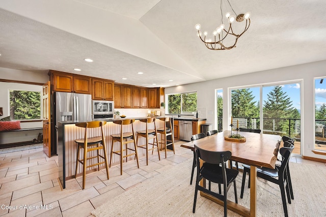 1273 S Grouse Meadow Dr, Coeur Dalene, ID 83814 - dining room featuring recessed lighting, a chandelier, vaulted ceiling, and a textured ceiling