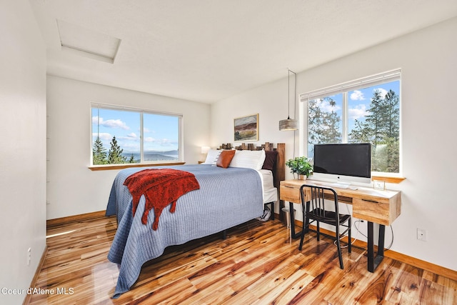 1273 S Grouse Meadow Dr, Coeur Dalene, ID 83814 - bedroom with attic access and wood finished floors