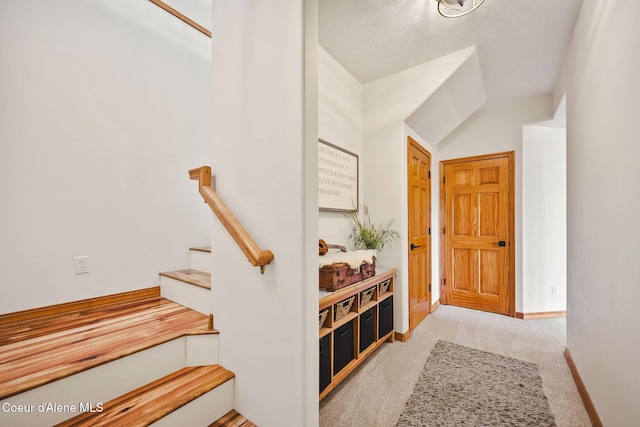 1273 S Grouse Meadow Dr, Coeur Dalene, ID 83814 - carpeted entrance foyer featuring stairs and baseboards