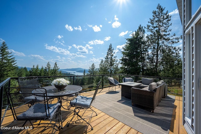 1273 S Grouse Meadow Dr, Coeur Dalene, ID 83814 - wooden terrace featuring a mountain view and outdoor dining space
