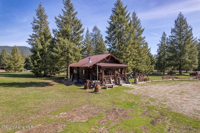 72 Hank Allen Way, Blanchard, ID 83804 - view of front facade with a front lawn, log siding, and a metal roof