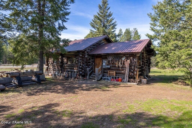 72 Hank Allen Way, Blanchard, ID 83804 - rear view of house featuring log siding and a metal roof