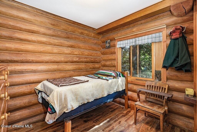 72 Hank Allen Way, Blanchard, ID 83804 - bedroom featuring log walls and wood finished floors