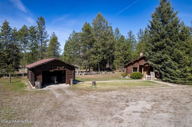 72 Hank Allen Way, Blanchard, ID 83804 - view of grassy yard featuring an outbuilding and a detached garage