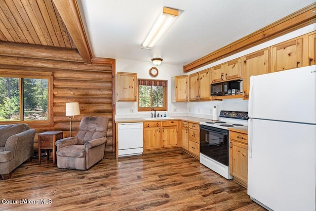 72 Hank Allen Way, Blanchard, ID 83804 - kitchen featuring white appliances, log walls, light countertops, dark wood finished floors, and light brown cabinetry