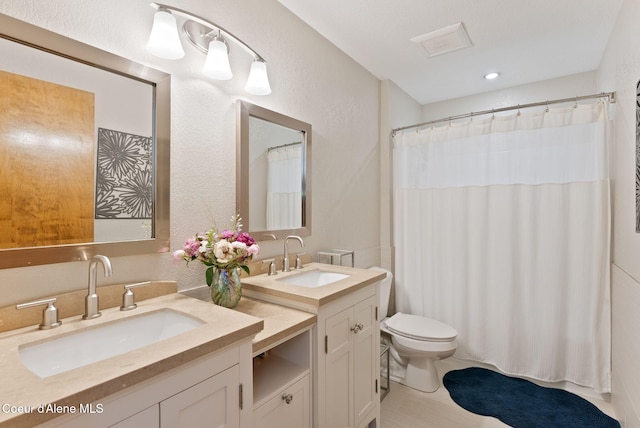 3011 E Fernan Ct, Coeur Dalene, ID 83814 - bathroom featuring double vanity, a shower with curtain, recessed lighting, and tile patterned flooring