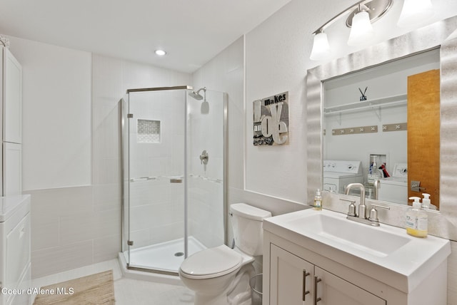 3011 E Fernan Ct, Coeur Dalene, ID 83814 - full bathroom featuring vanity, washer and dryer, and a shower stall