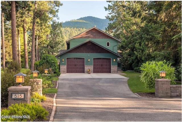 515 S Idaho St, Post Falls, ID 83854 - view of front of property with concrete driveway and a mountain view