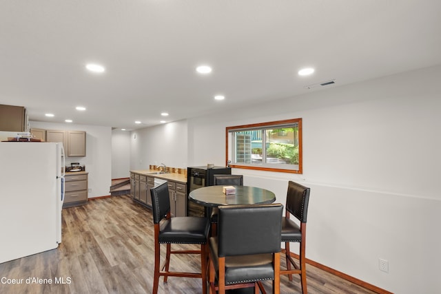 515 S Idaho St, Post Falls, ID 83854 - dining area featuring recessed lighting, light wood finished floors, and wet bar