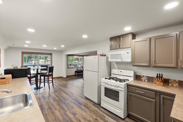 515 S Idaho St, Post Falls, ID 83854 - kitchen with white appliances, recessed lighting, light countertops, and dark wood-style floors
