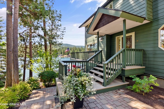 515 S Idaho St, Post Falls, ID 83854 - view of exterior entry featuring a deck with mountain view