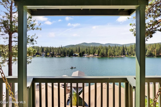 515 S Idaho St, Post Falls, ID 83854 - water view featuring a forest and a mountain backdrop