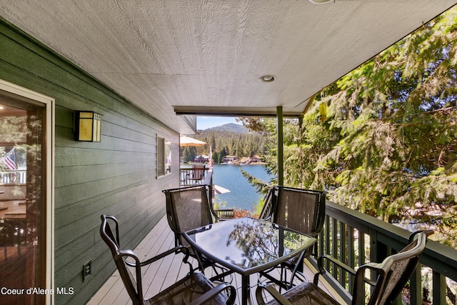 515 S Idaho St, Post Falls, ID 83854 - wooden deck with a water view and outdoor dining space