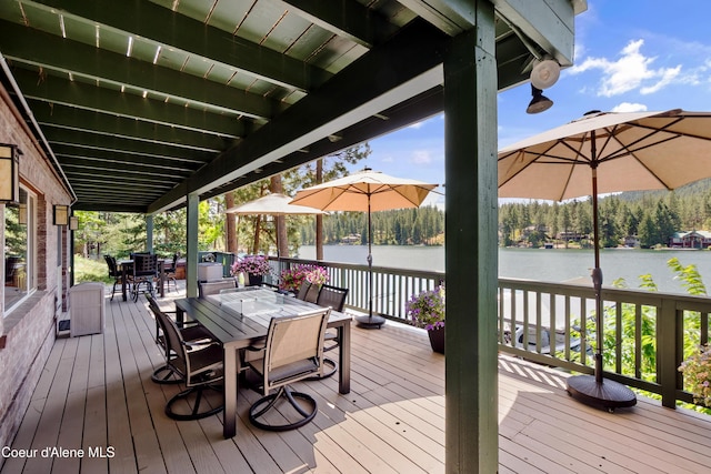 515 S Idaho St, Post Falls, ID 83854 - wooden deck featuring outdoor dining area and a water view