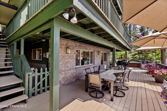 515 S Idaho St, Post Falls, ID 83854 - deck featuring a covered hot tub and outdoor dining space
