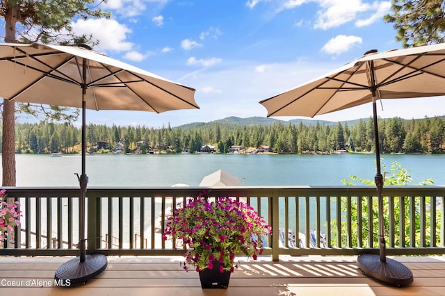 515 S Idaho St, Post Falls, ID 83854 - wooden terrace featuring a water and mountain view and a view of trees