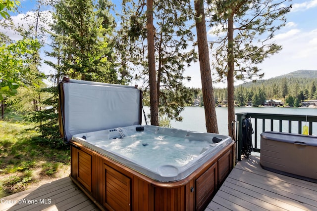 515 S Idaho St, Post Falls, ID 83854 - deck featuring a hot tub and a water view