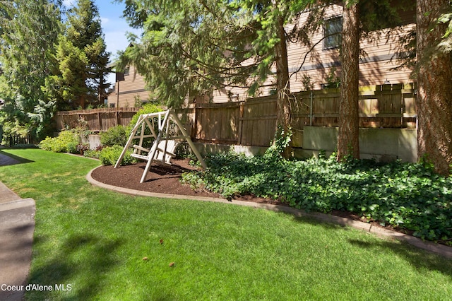 515 S Idaho St, Post Falls, ID 83854 - fenced backyard with a playground