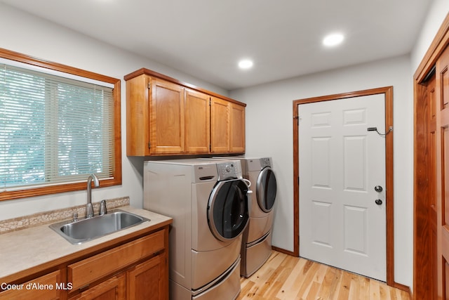 515 S Idaho St, Post Falls, ID 83854 - washroom with washer and dryer, cabinet space, light wood-style flooring, and recessed lighting