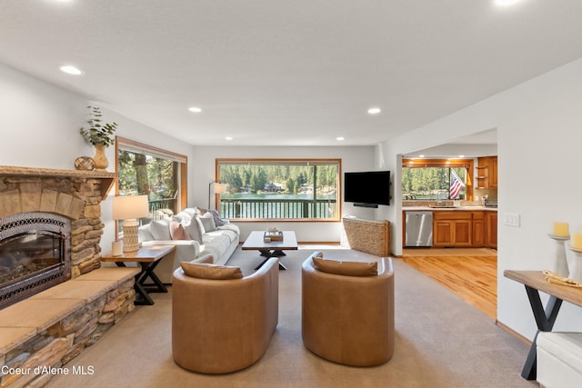 515 S Idaho St, Post Falls, ID 83854 - living area featuring light colored carpet, a stone fireplace, and recessed lighting