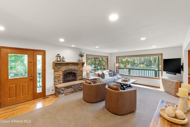 515 S Idaho St, Post Falls, ID 83854 - living area featuring recessed lighting, a stone fireplace, and wood finished floors
