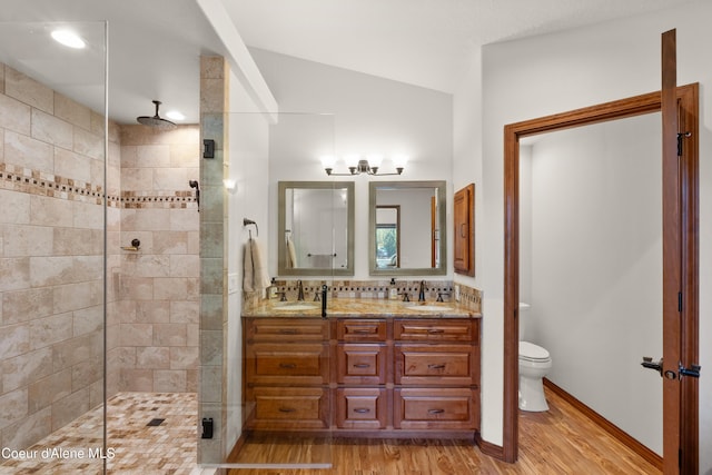 515 S Idaho St, Post Falls, ID 83854 - bathroom featuring a shower stall, double vanity, wood finished floors, and a chandelier