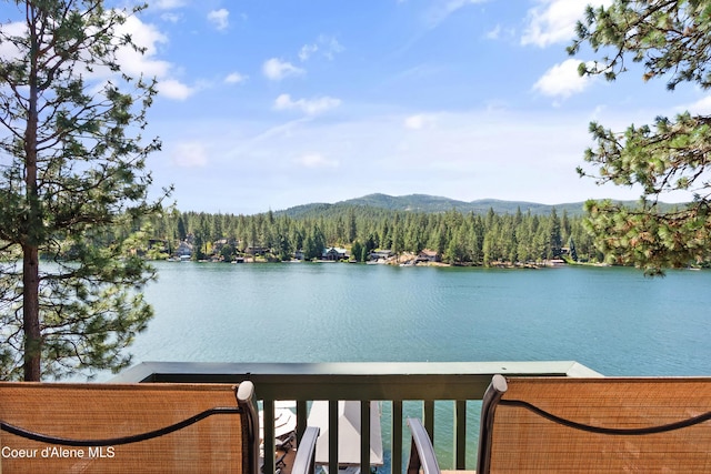 515 S Idaho St, Post Falls, ID 83854 - water view featuring a heavily wooded area and a mountainous background